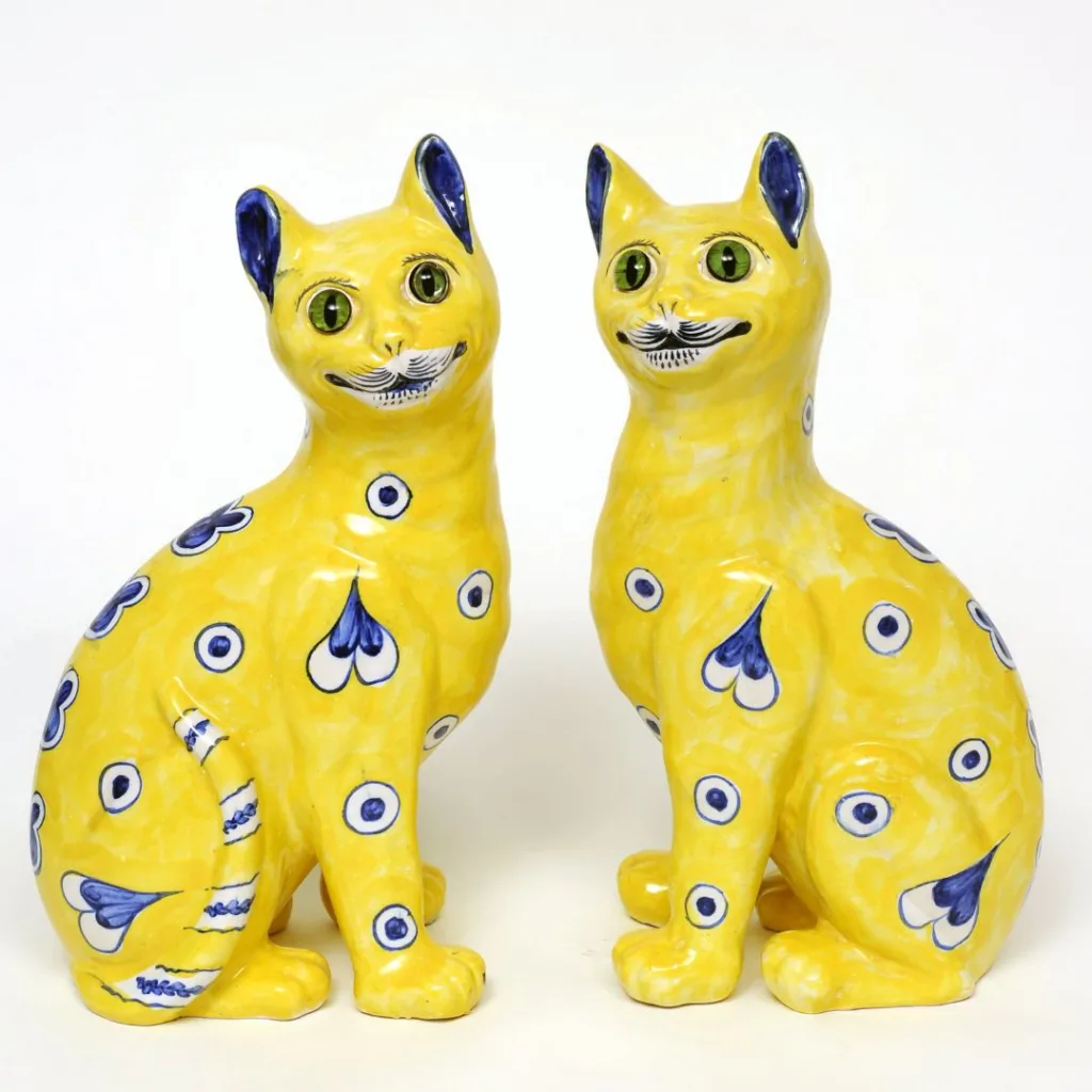 Image of yellow ceramic cats by Emile Gallé