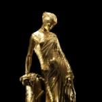 Silver statue of Sappho against a black background