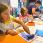 Image of children during a printing workshop