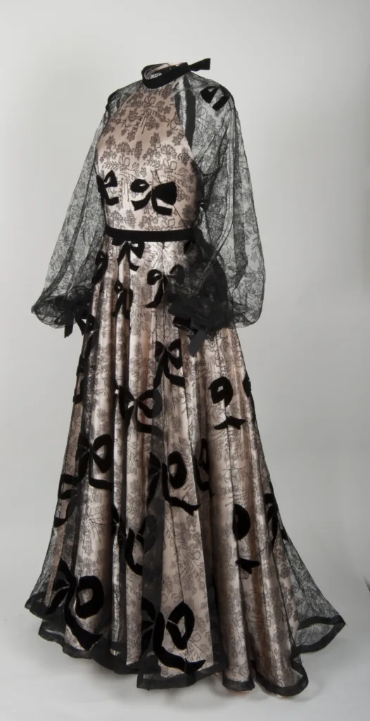 Image of a black chattily lace and silk dress by French designer, Madeleine Vionnet