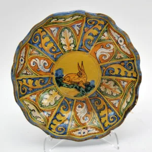 Image of a Montelupo Maiolica Dish decorated with blue, orange, white and yellow showcasing a rabbit in the middle