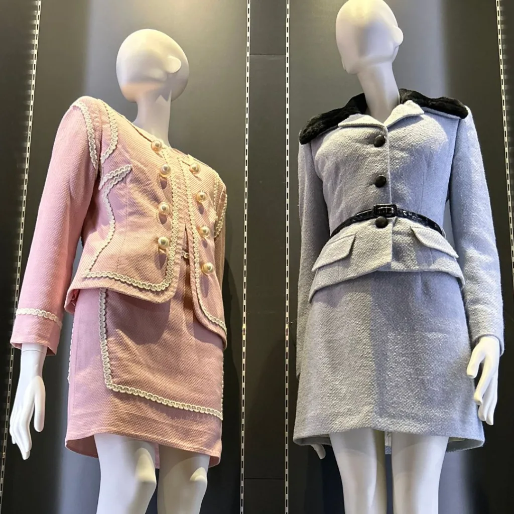 Image of 2 costumes in the display case