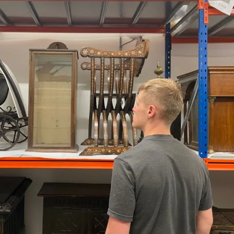 Image of a member of staff in one of the Museum stores