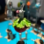 Image of an automaton created in the Cabaret Mechanical Theatre self guided workshop showing a unicorn head, lettuce and a tomato.