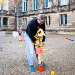 Image of a woman and child playing in the museum grounds