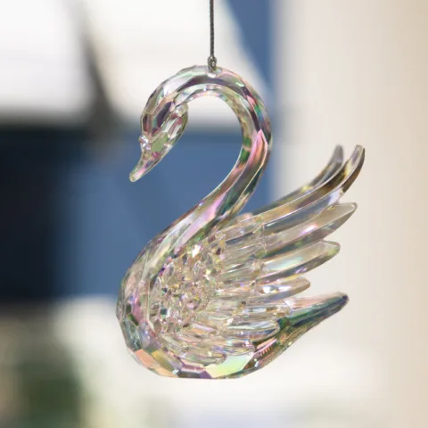 A silver swan Christmas decoration made from glass.