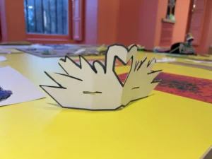 Swans made from white card.