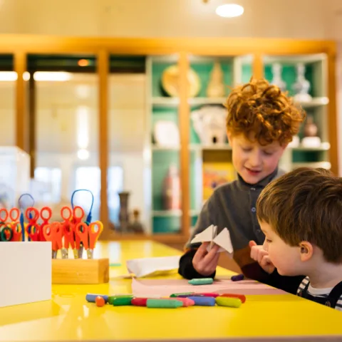 Two children using the create space.