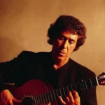 Juan Martin, holding his guitair.
