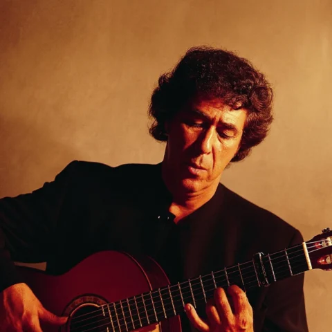 Juan Martin, holding his guitair.
