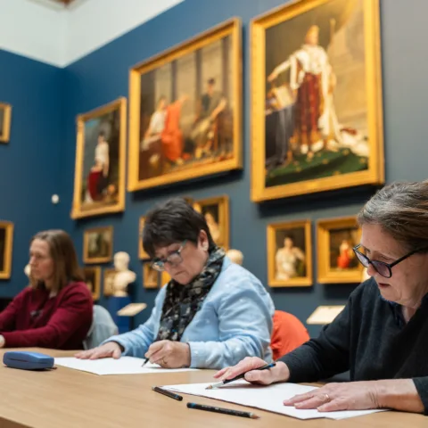 Adults taking part in a art workshop.