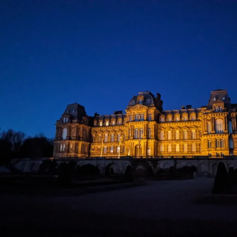 The Bowes Museum light up at night.