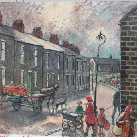 A painted street scene shows a row of grey stone terraced houses with red chimney pots lining the left side of a road. In the foreground, several figures walk along the street carrying baskets and pushing a pram, while a horse pulls a small cart with a painted sign on its side. A tall streetlamp stands near the centre of the scene. To the right, a brick wall frames the edge of the street, with more figures and buildings visible in the background. The sky is cloudy and textured, with birds flying above, and the overall palette uses muted greys, browns, and soft reds.